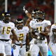 Wide receiver Martez Carter #4 of the Grambling State Tigers celebrates with teammates after scoring a touchdown against the Arizona Wildcats in the second quarter at Arizona Stadium.